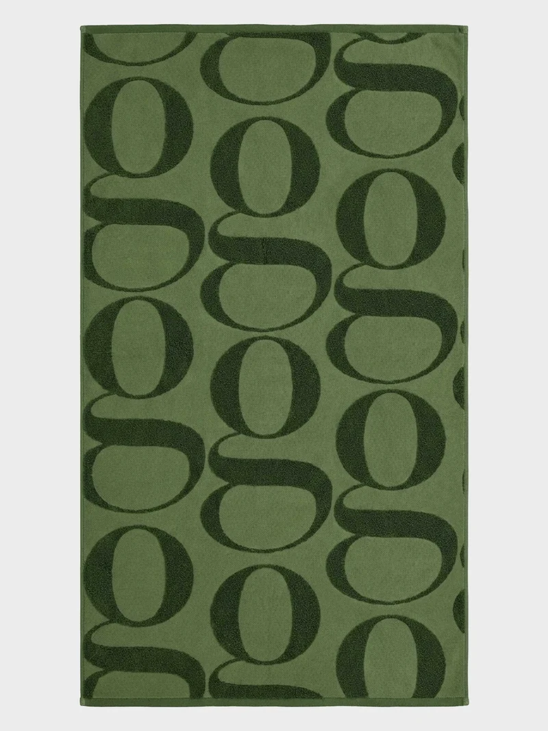 Toalla 100% algodón con jacquard logo gisela. 150 x 100 cm
